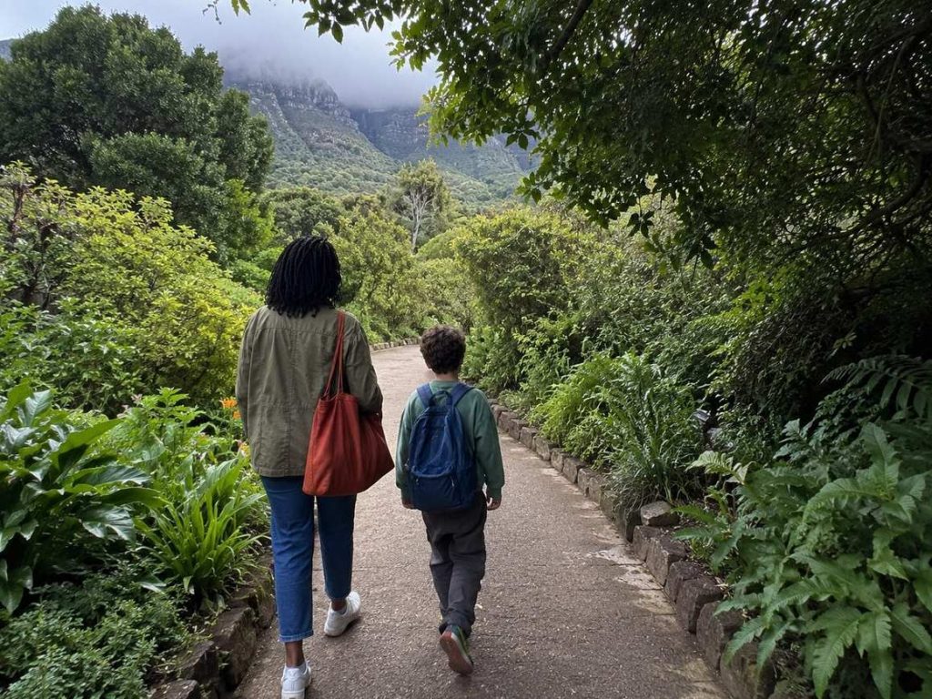 Family walking along a forest path in Kirstenbosch National Botanical Garden